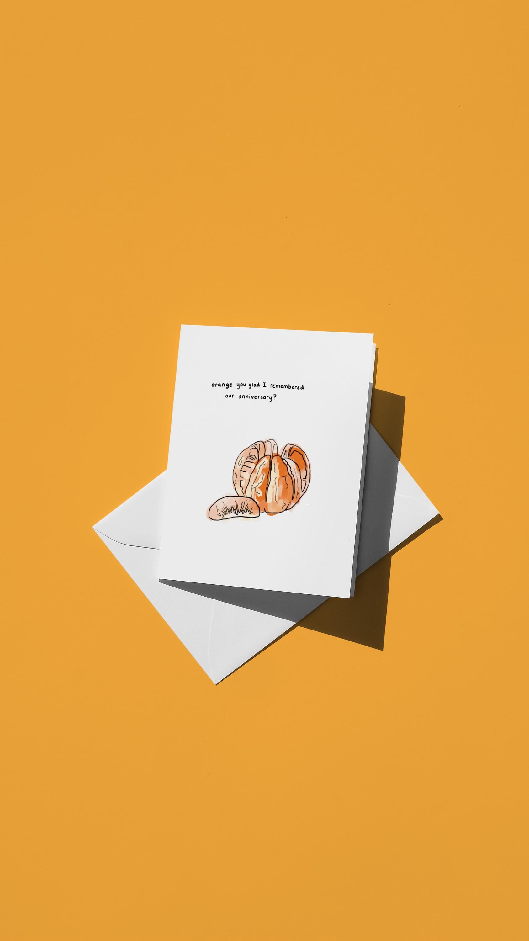 Hand-drawn illustration of an orange with the message "orange you glad I remembered our anniversary?"