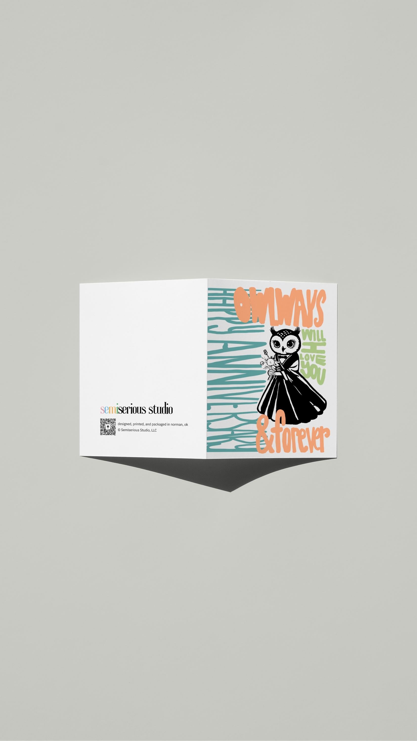 Owlways and Forever Anniversary card standing open, showing the front artwork and the Semiserious Studio logo on the back