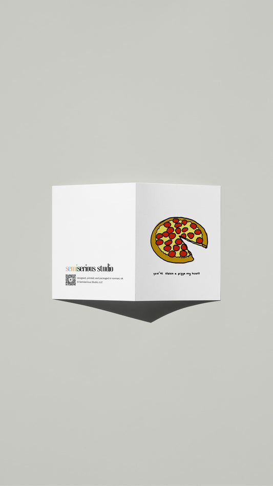 Pizza My Heart Valentine card standing open, showing the front artwork and the Semiserious Studio logo on the back