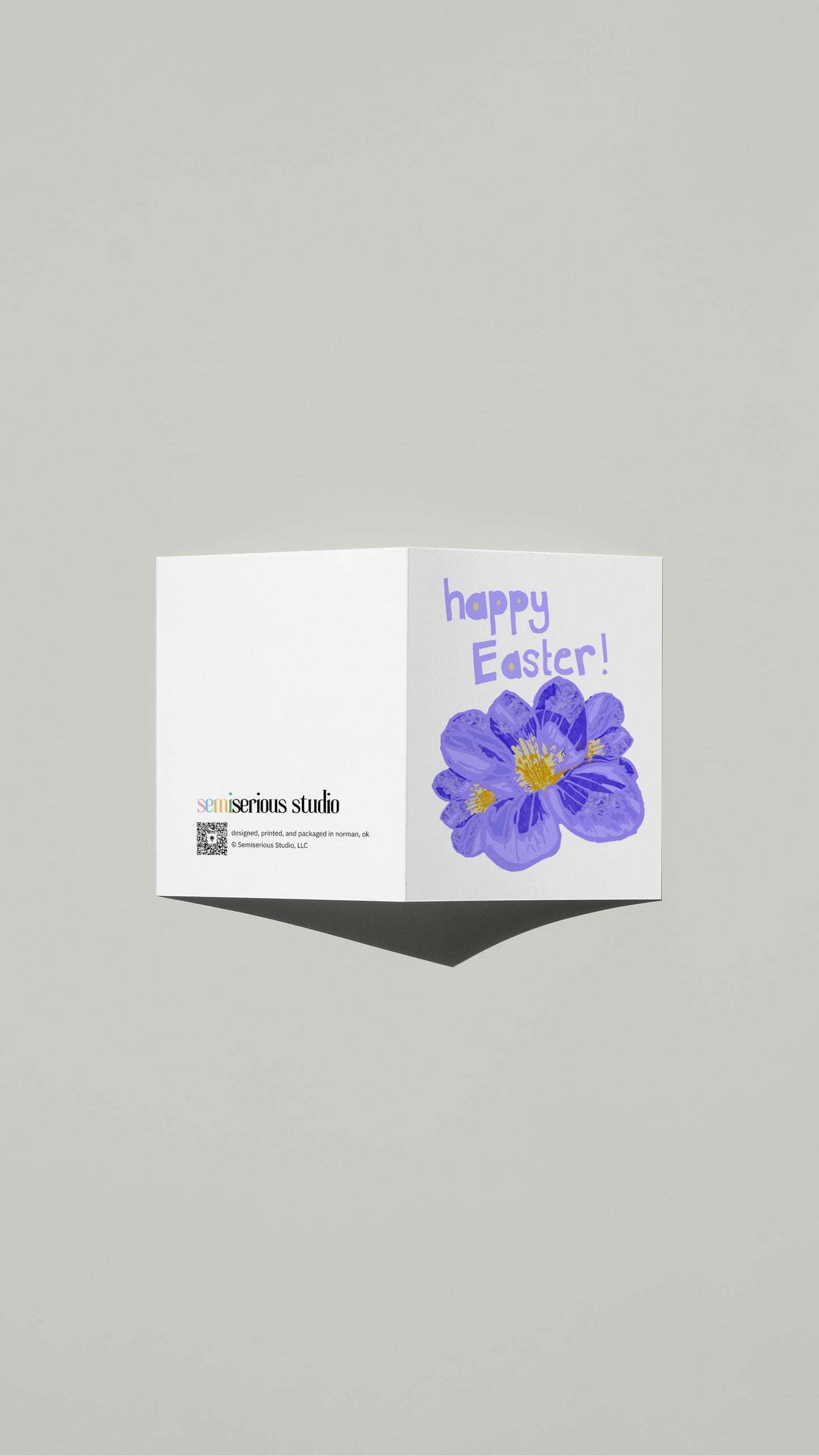 Purple Floral Easter card standing open, showing the front artwork and the Semiserious Studio logo on the back