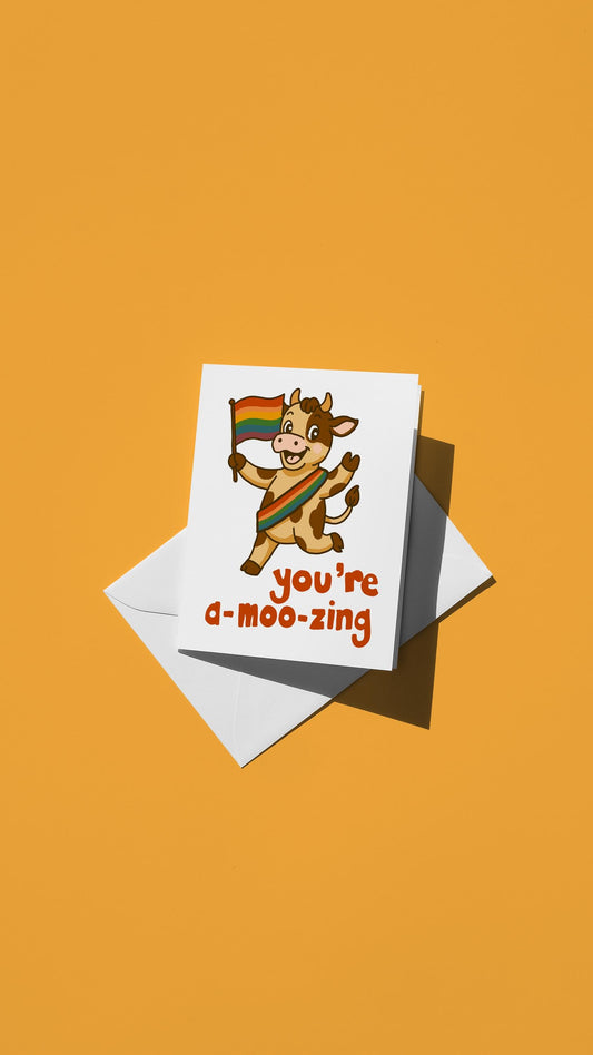 Hand-drawn illustration of a cow wearing a rainbow sash and carrying a rainbow flag with the message "you're a-moo-zing"