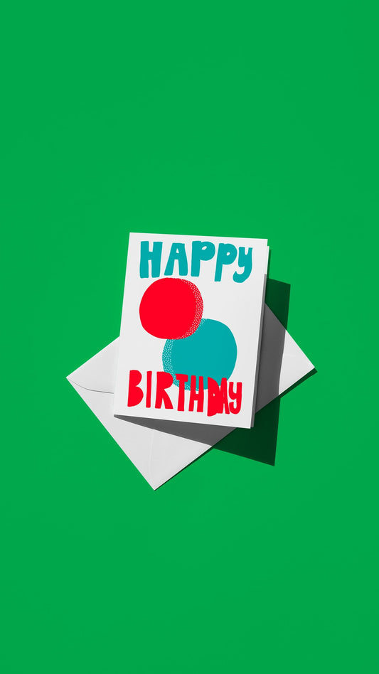 Hand-drawn illustration of red and blue circles with the message "HAPPY BIRTHDAY"