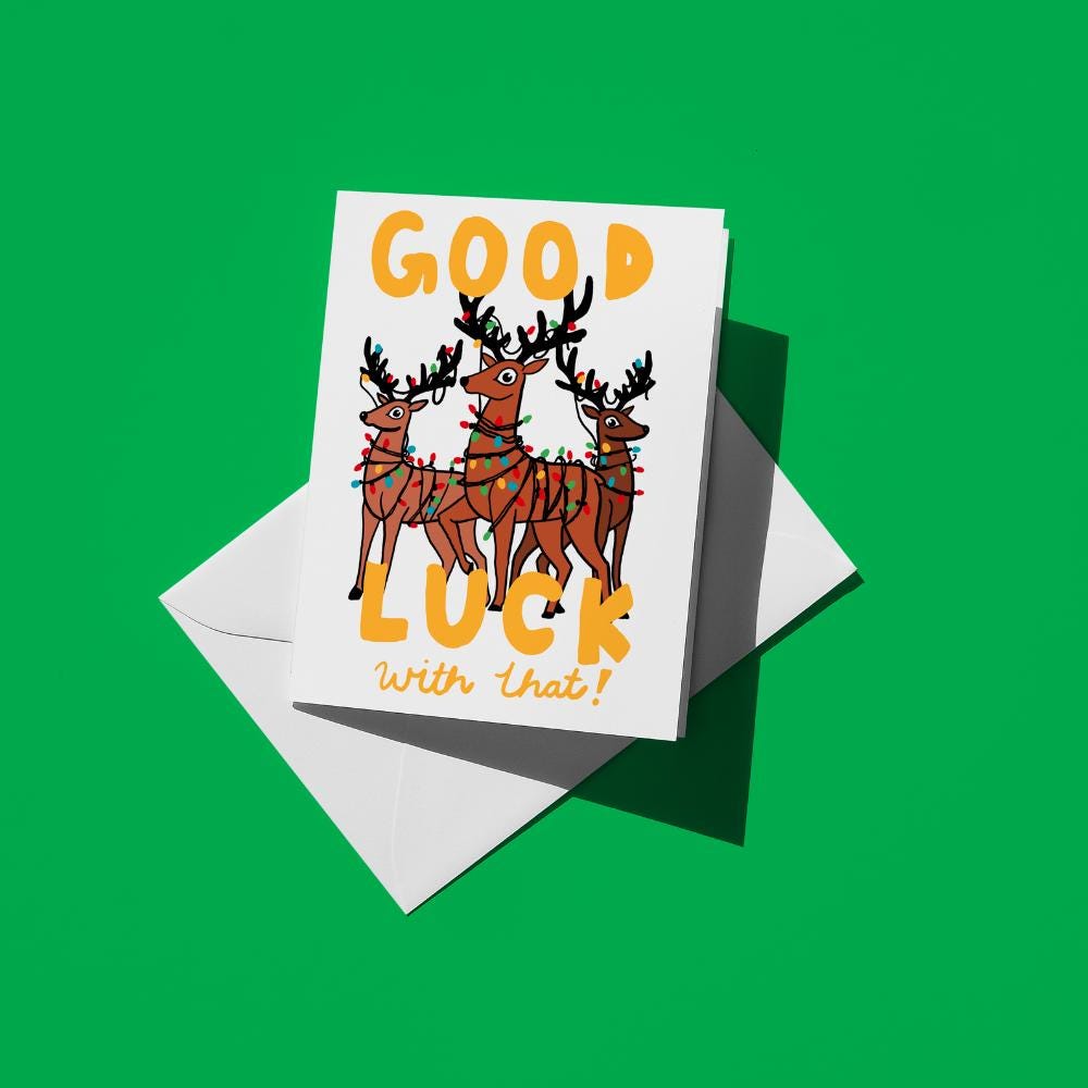 Reindeer tangled in a string of Christmas lights, reading "Good luck with that!"