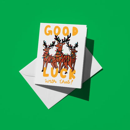 Reindeer tangled in a string of Christmas lights, reading "Good luck with that!"