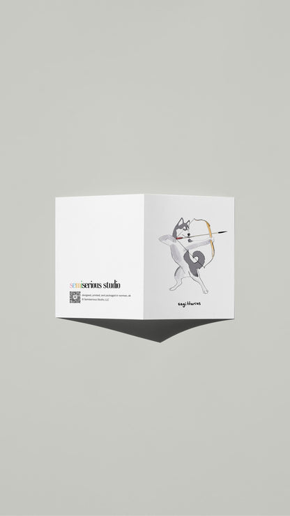 Sagittarius Husky Archer Birthday card standing open, showing the front artwork and the Semiserious Studio logo on the back