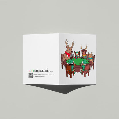 Santa's Helpers Playing Poker Christmas card standing open, showing the front artwork and the Semiserious Studio logo on the