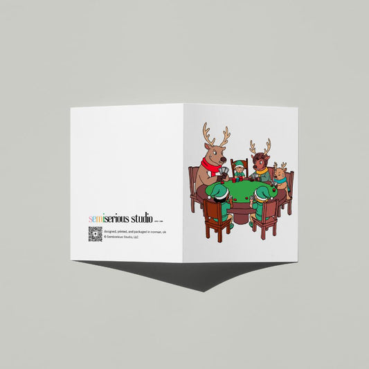 Santa's Helpers Playing Poker Christmas card standing open, showing the front artwork and the Semiserious Studio logo on the