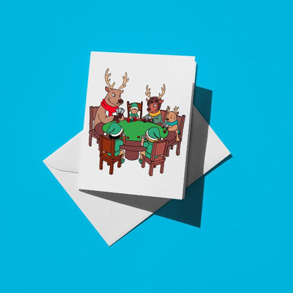 Reindeer in Santa hats playing poker around a green card table