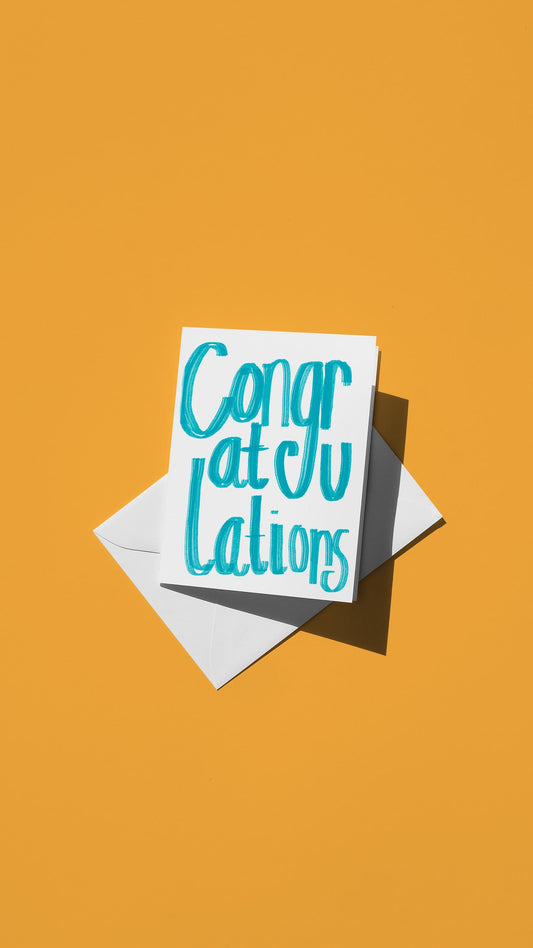Hand-drawn illustration of the message "congratulations" in simple blue text