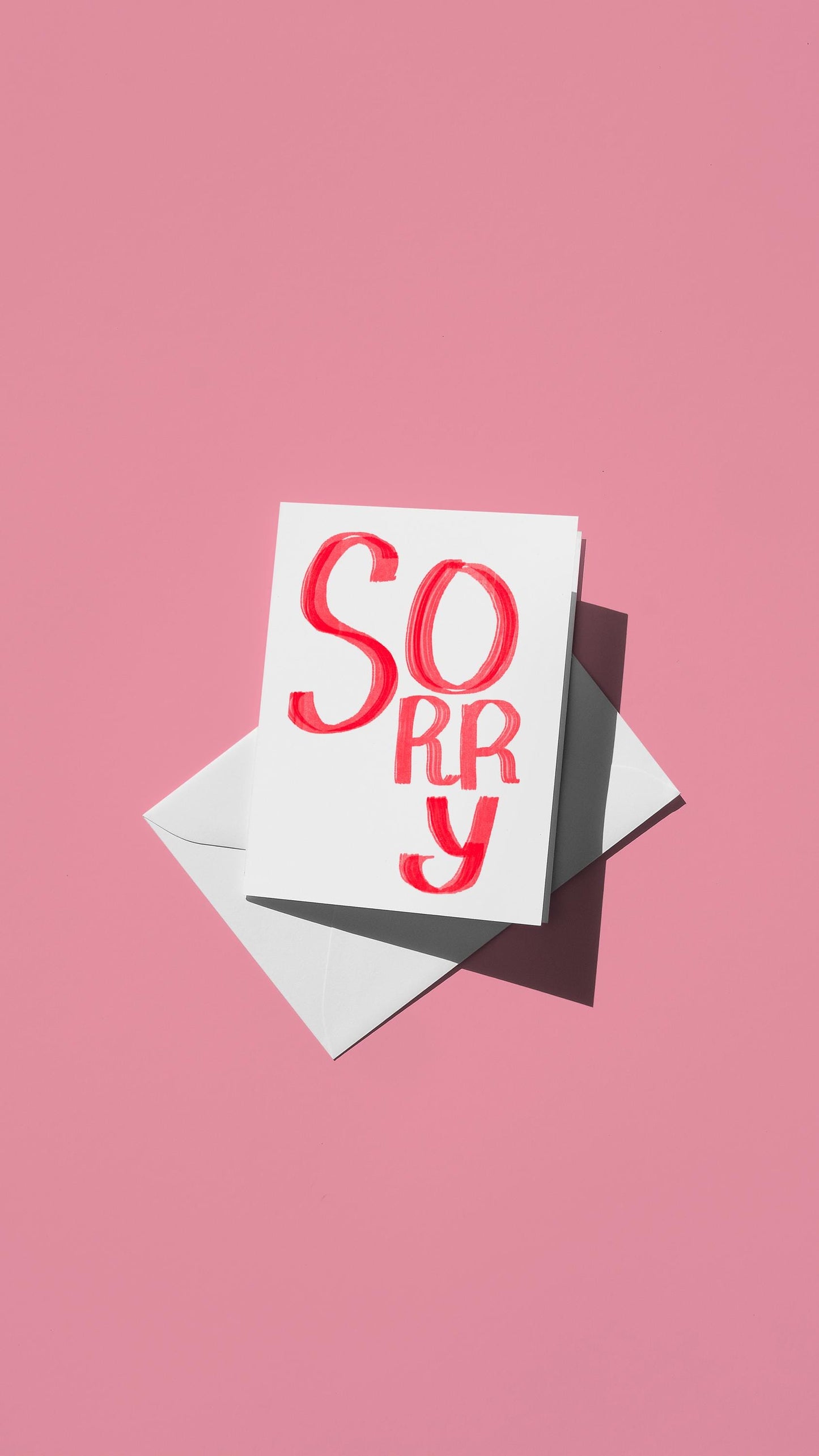 Hand-drawn illustration of hand-drawn message of "SORRY" in red on a white background