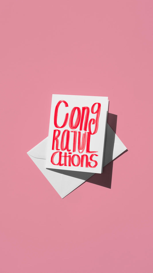 Hand-drawn illustration of the message "congratulations" in simple red text