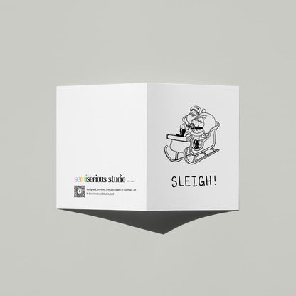 Simple Santa Sleigh Christmas card standing open, showing the front artwork and the Semiserious Studio logo on the back