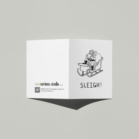 Simple Santa Sleigh Christmas card standing open, showing the front artwork and the Semiserious Studio logo on the back