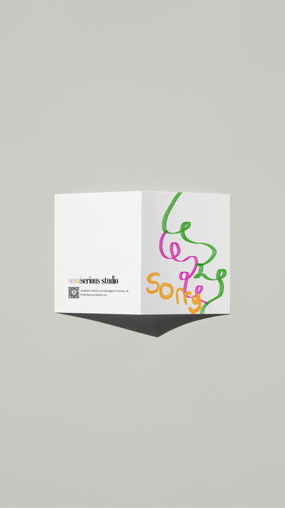 Hand-drawn illustration of colorful ribbons and a message of "sorry"