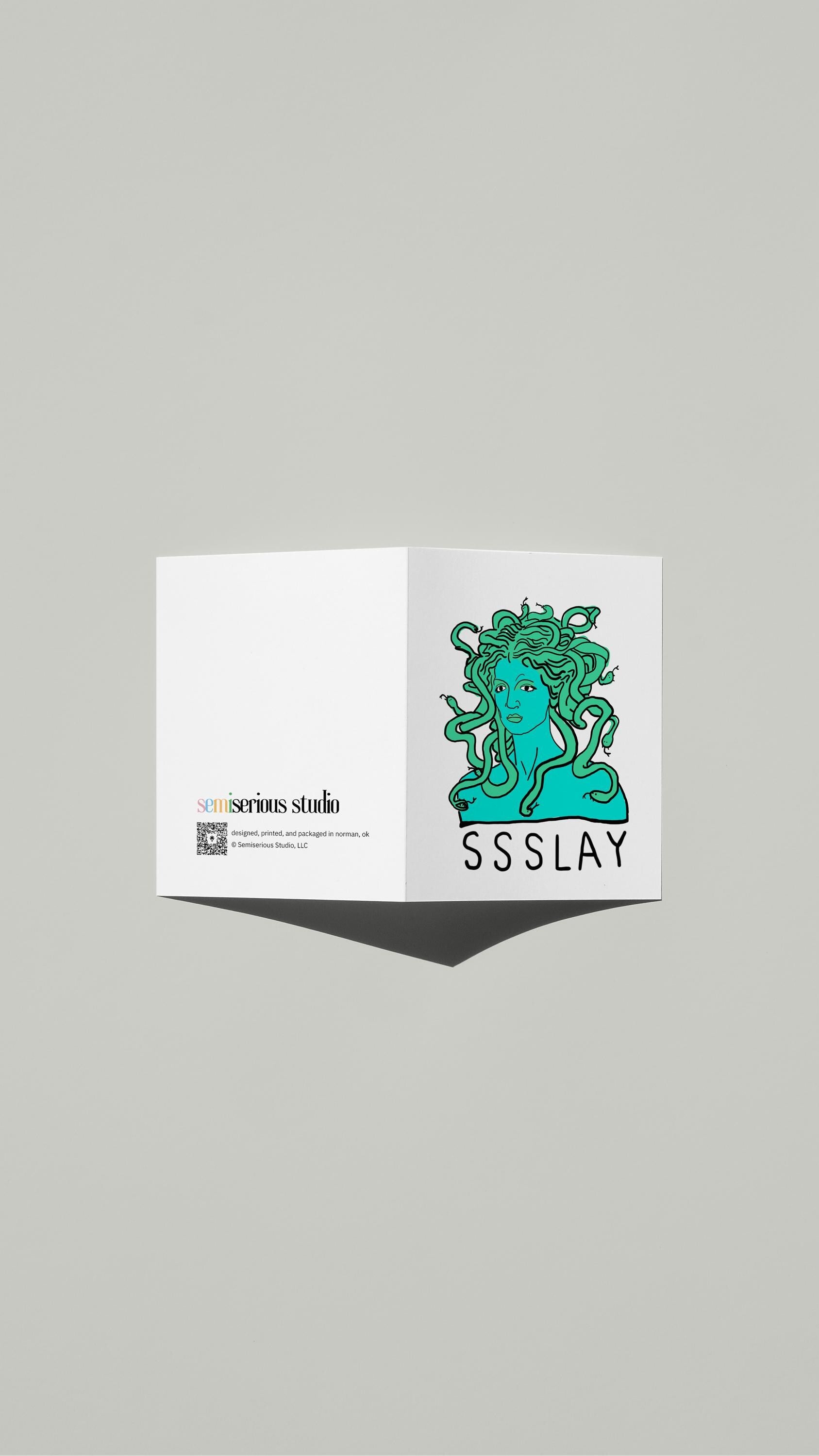 SSSLAY Medusa card standing open, showing the front artwork and the Semiserious Studio logo on the back