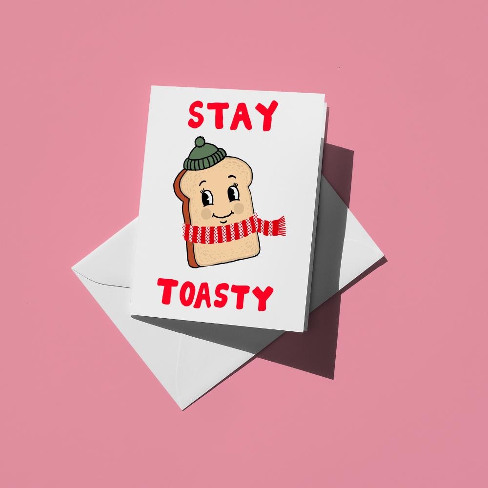 Smiling slice of toast wearing a striped scarf, with red text reading "Stay toasty"
