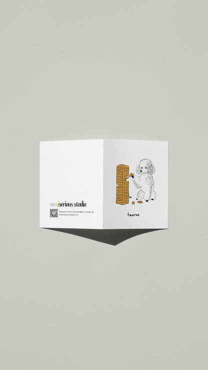 Taurus Poodle Jenga Birthday card standing open, showing the front artwork and the Semiserious Studio logo on the back