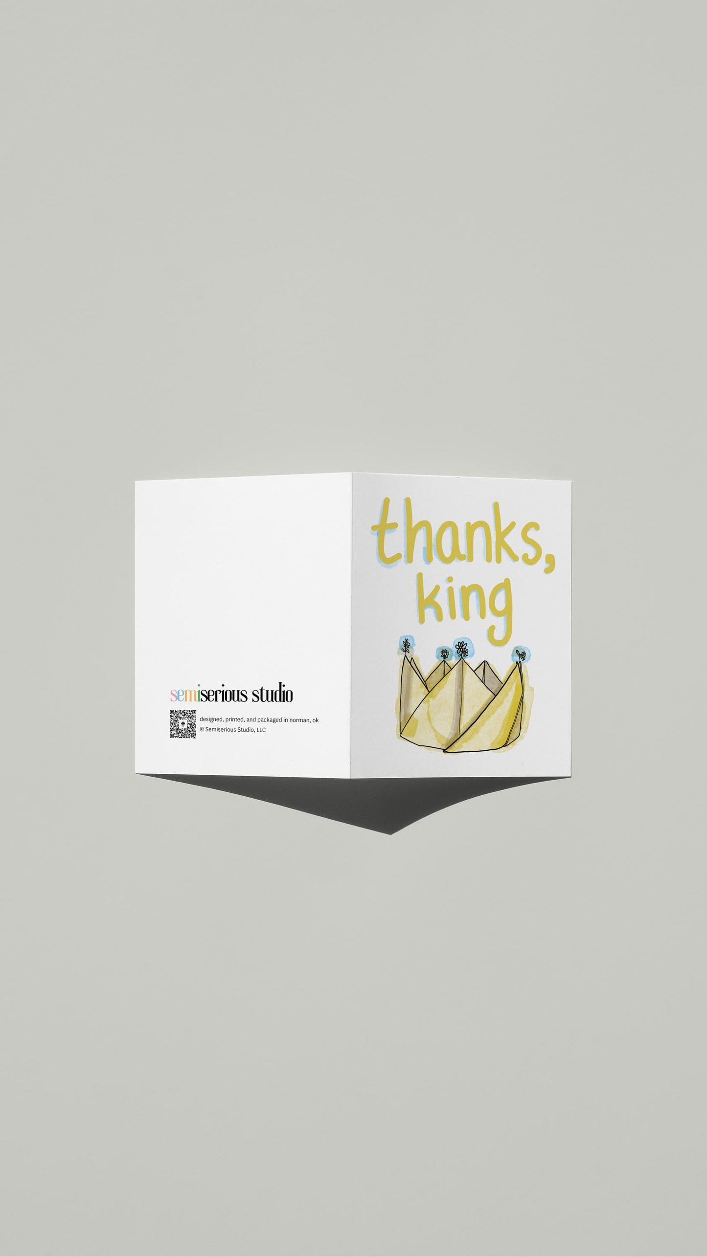 Thanks King Thank You card standing open, showing the front artwork and the Semiserious Studio logo on the back
