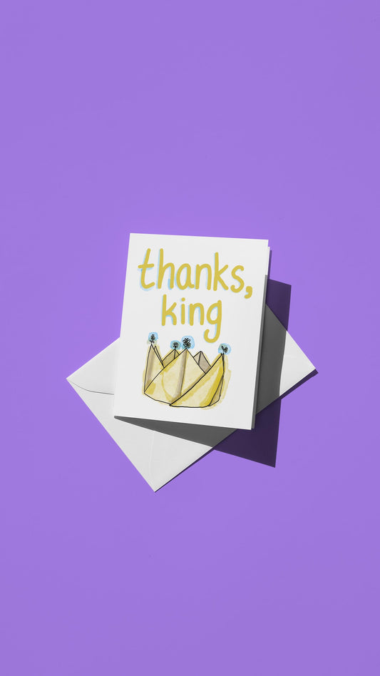 Hand-drawn illustration of a paper crown with the message "thanks, king"