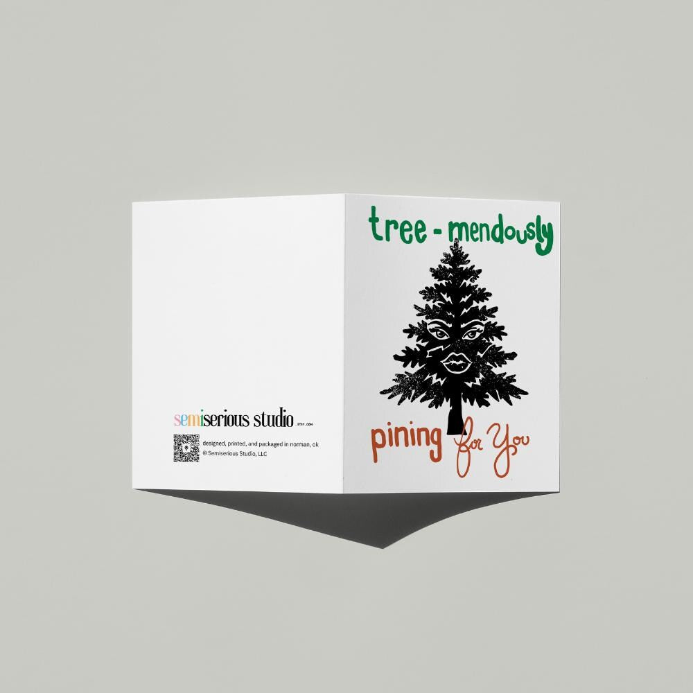 Tree-mendously Pining for You Holiday card standing open, showing the front artwork and the Semiserious Studio logo on the