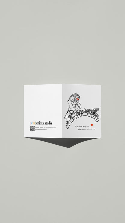 Wannabe My Lover Troll Bridge Valentine card standing open, showing the front artwork and the Semiserious Studio logo on the