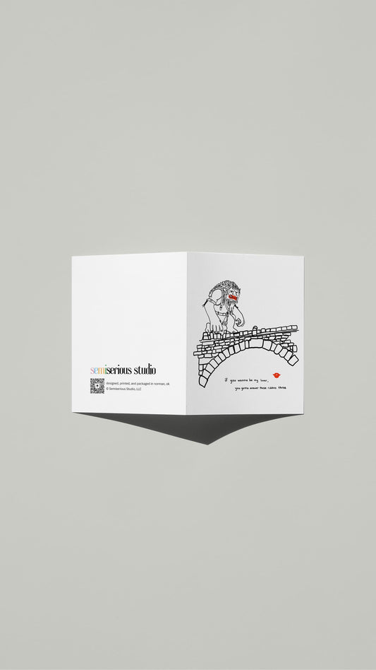 Wannabe My Lover Troll Bridge Valentine card standing open, showing the front artwork and the Semiserious Studio logo on the