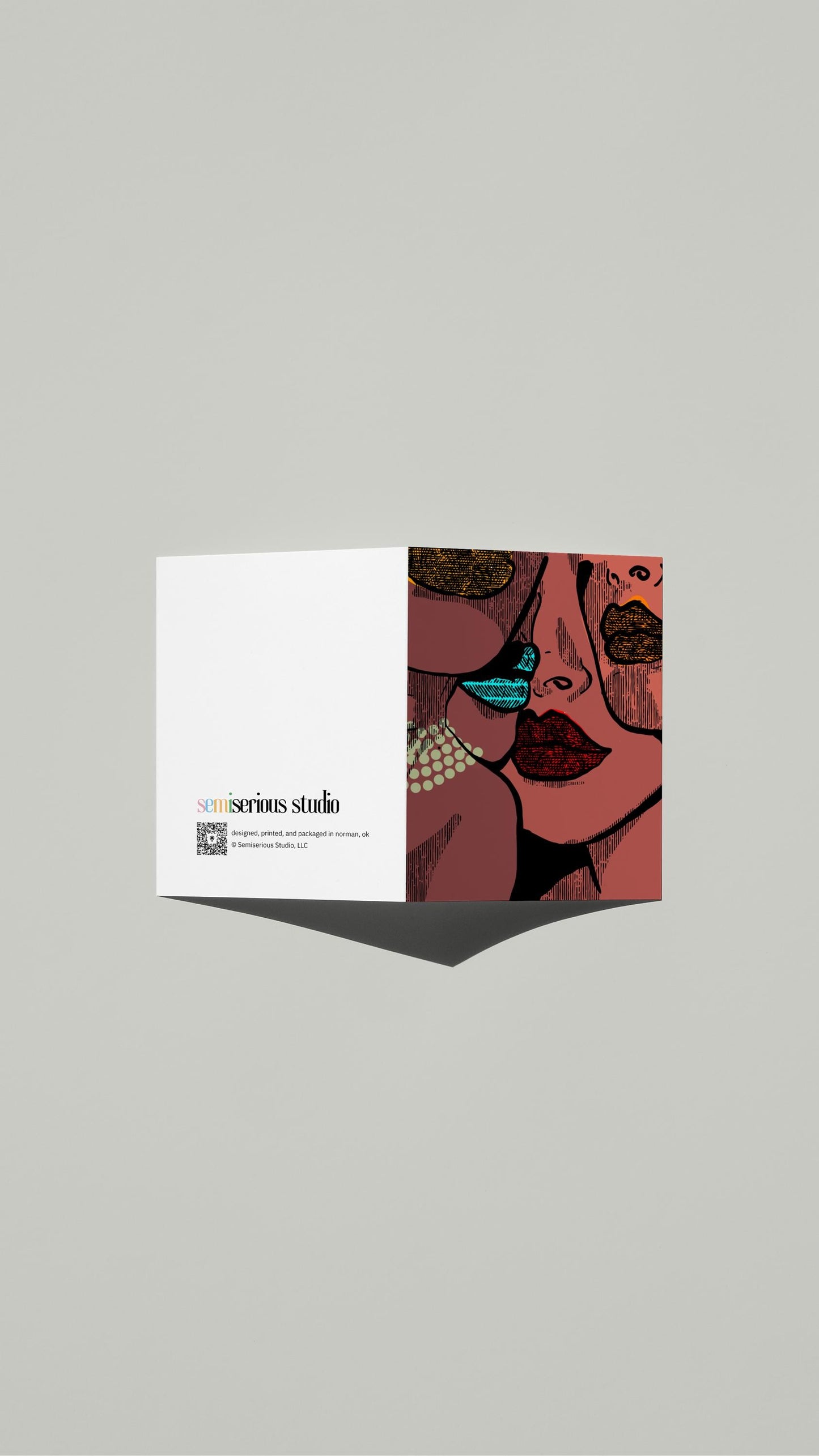 Women with Lipstick & Pearls card standing open, showing the front artwork and the Semiserious Studio logo on the back
