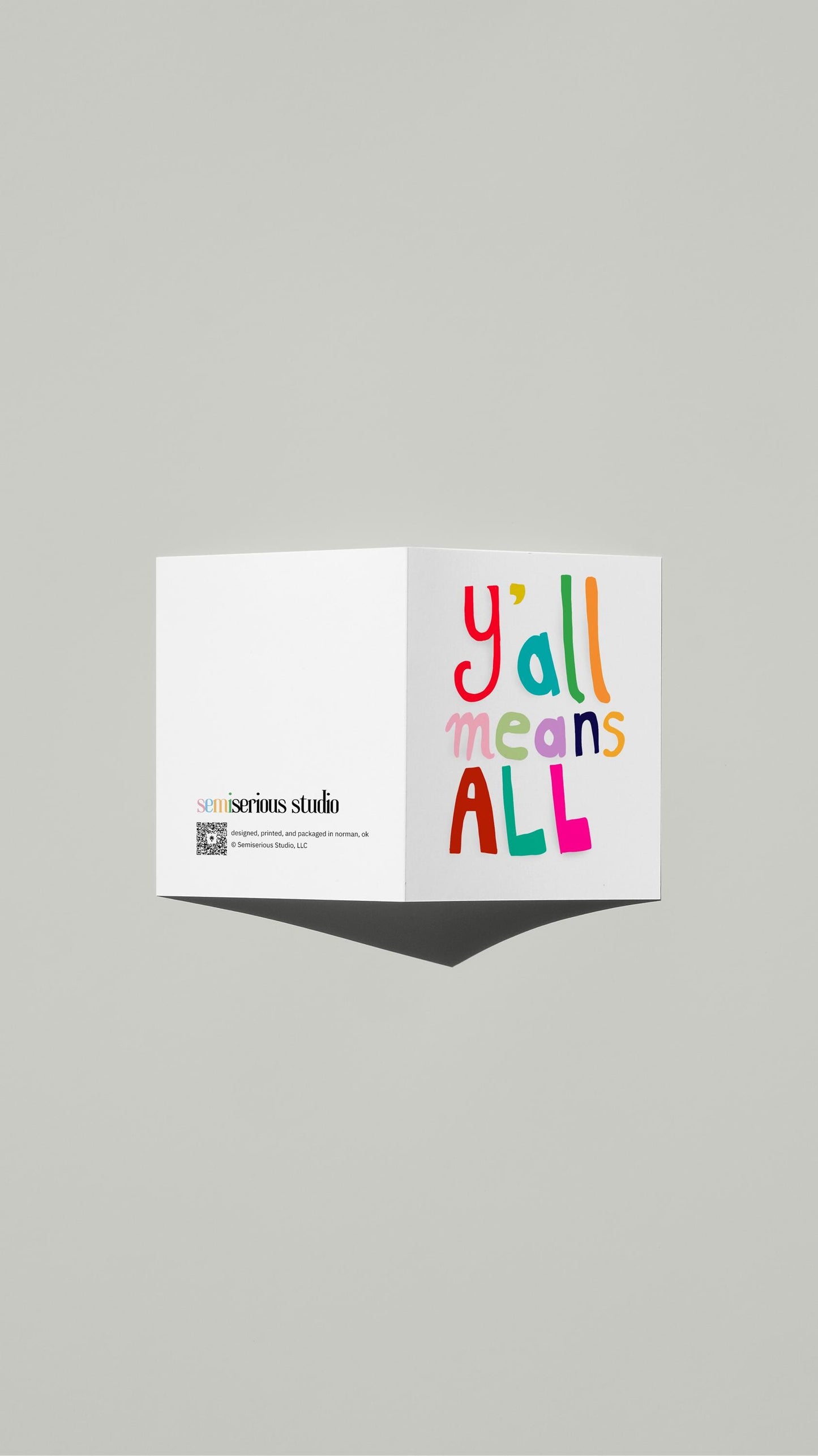 Y'all Means All Pride card standing open, showing the front artwork and the Semiserious Studio logo on the back